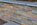 Copper slate strip retaining wall
